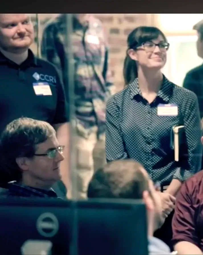 Smiling beCamp attendees wearing name tags