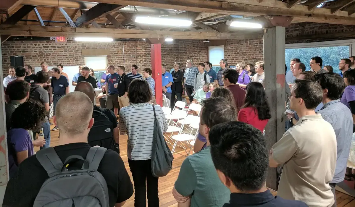 The beCamp crowd gathered beneath the timber rafters