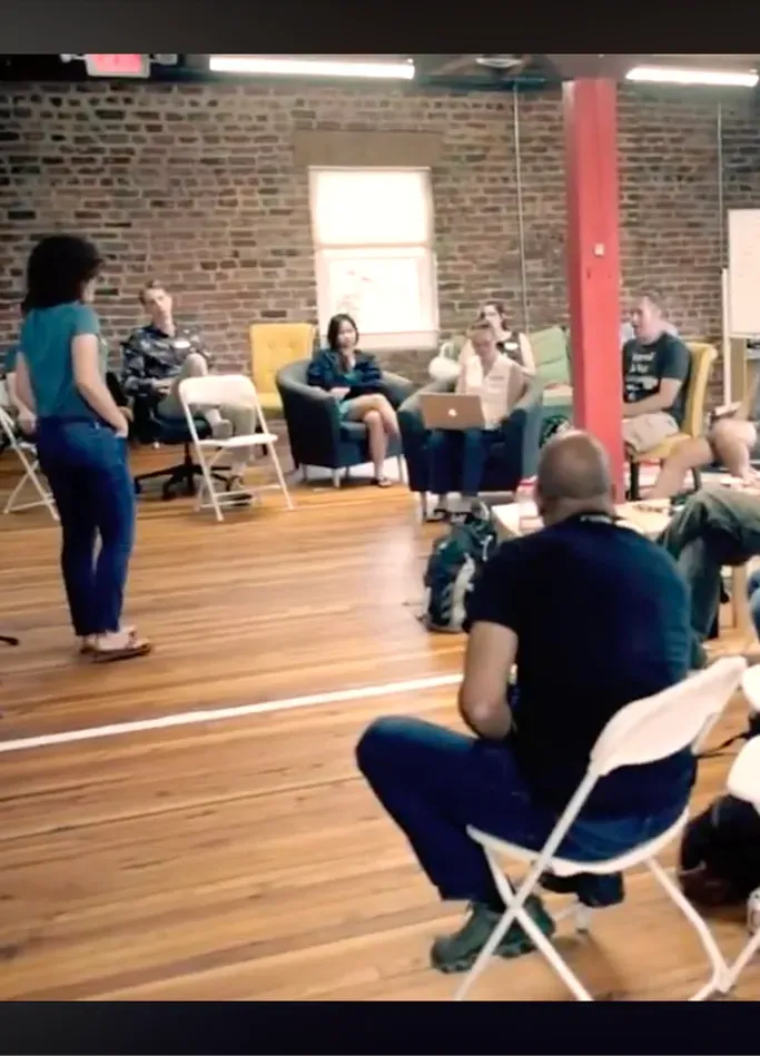 An unconference discussion circle at beCamp