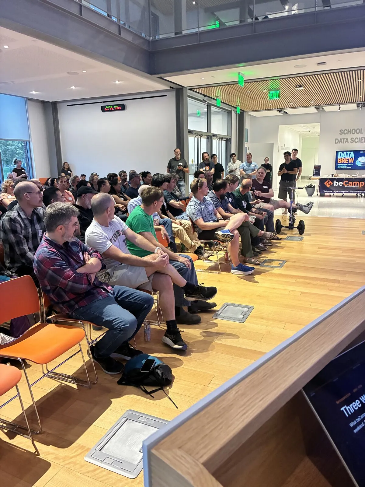 The Pitch Night audience in rows of orange chairs, seen from the lectern